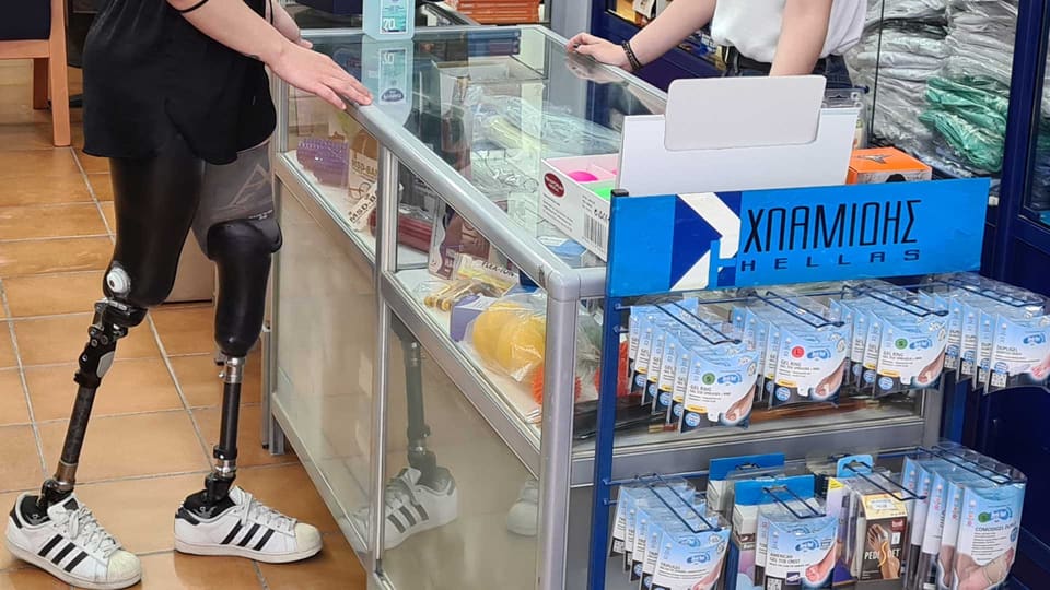 Young woman with lower limb prostheses at the Hlamidis Orthopaedic Center shop in Thessaloniki