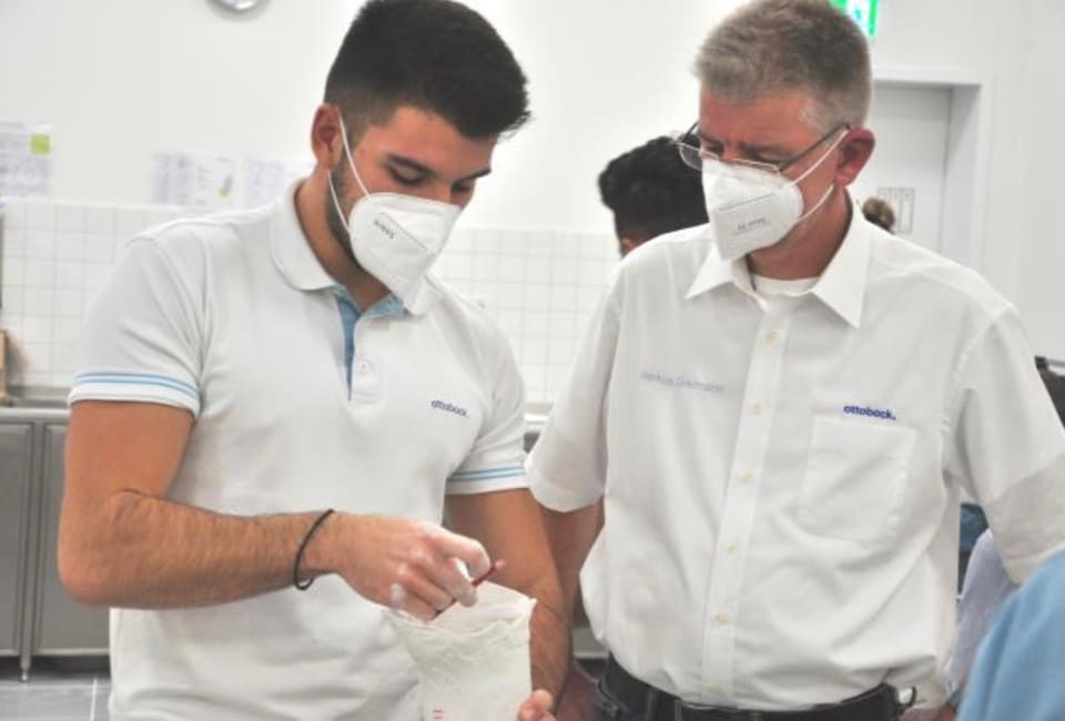 Prosthetist-orthotists from Hlamidis Orthopaedic Center examining an orthopaedic device